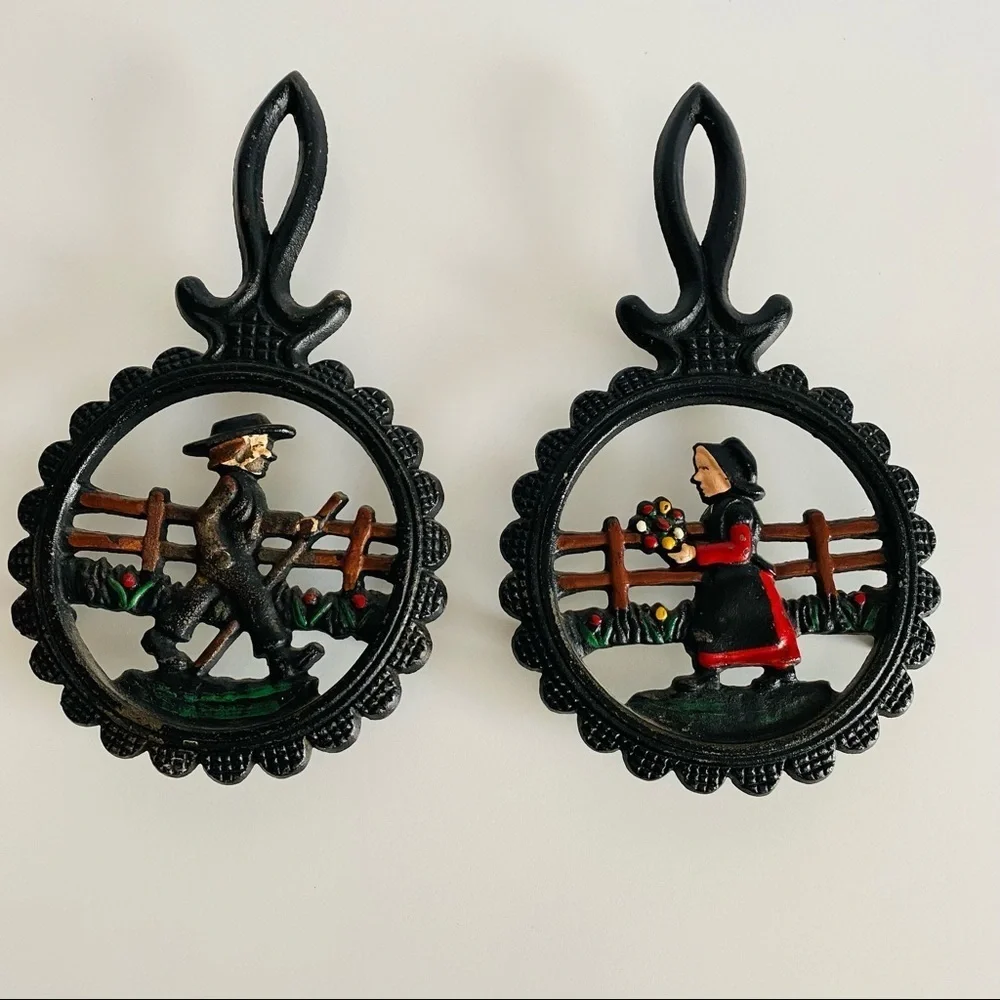 Vintage  Cast Iron Amish Woman and  man Trivets.